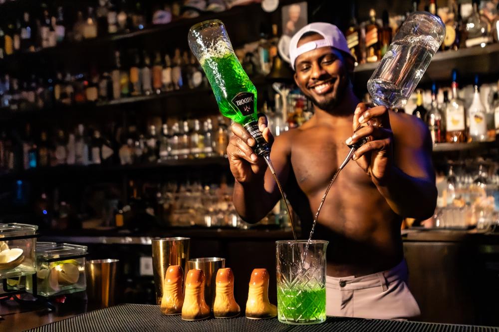 Bartender mixing drinks at Schmittys WeHo in West Hollywood