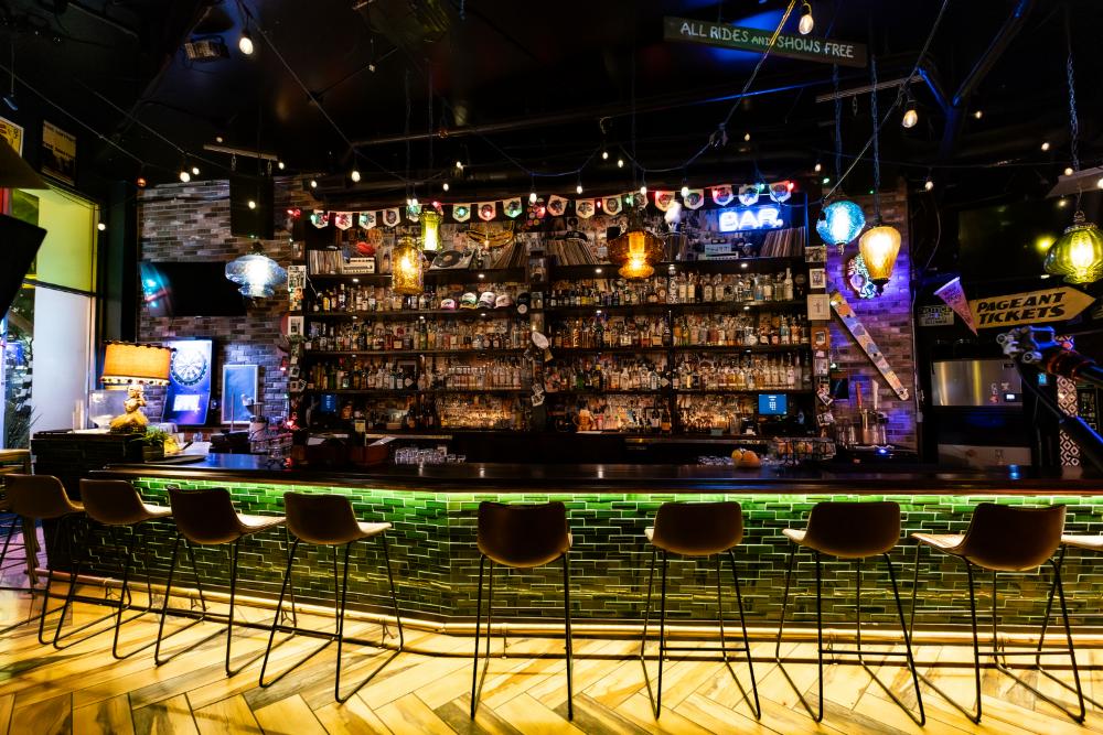 Interior seating and liquor shelves at Schmittys WeHo